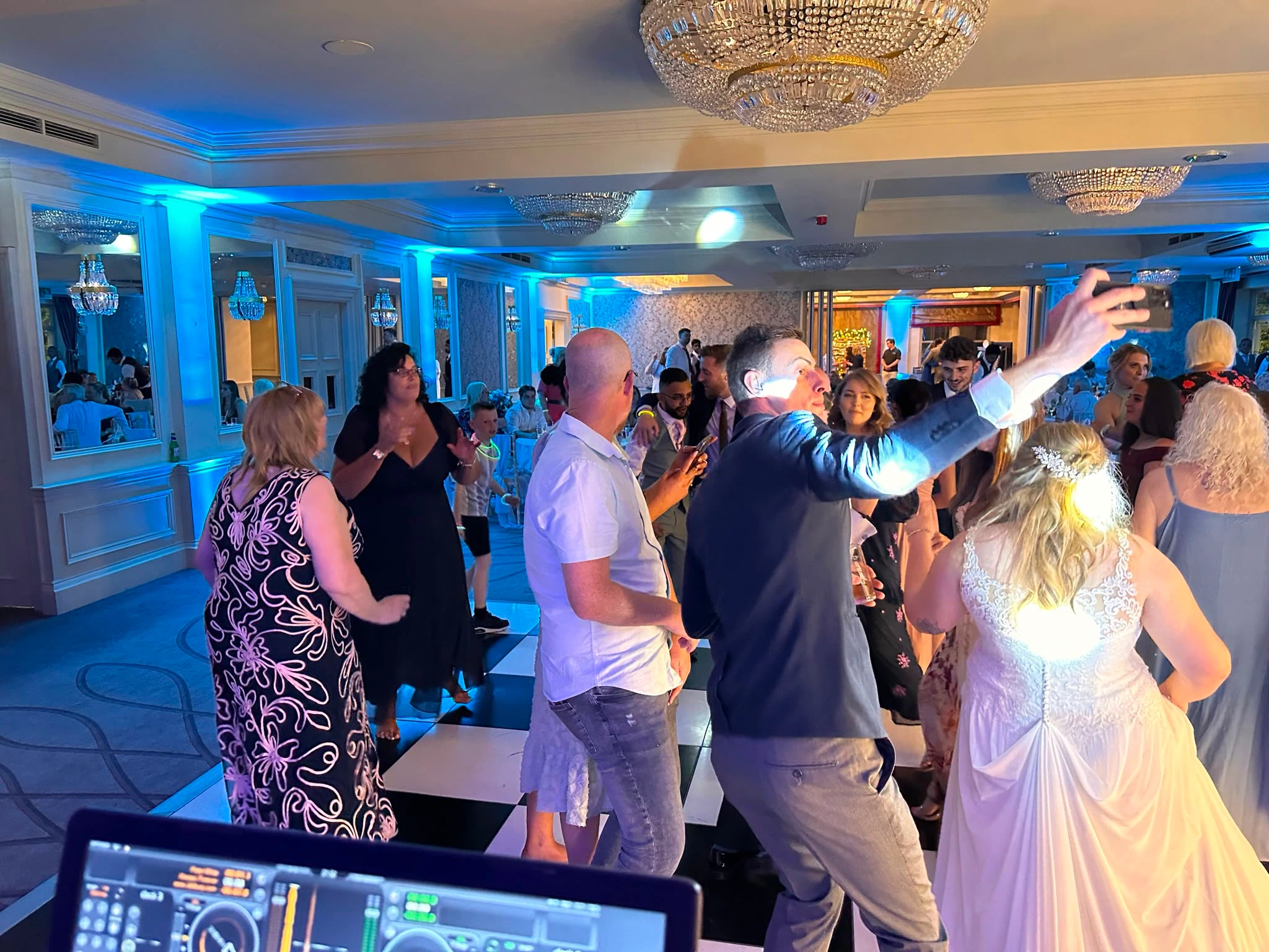 Guests crowding round the couple on the dance floor