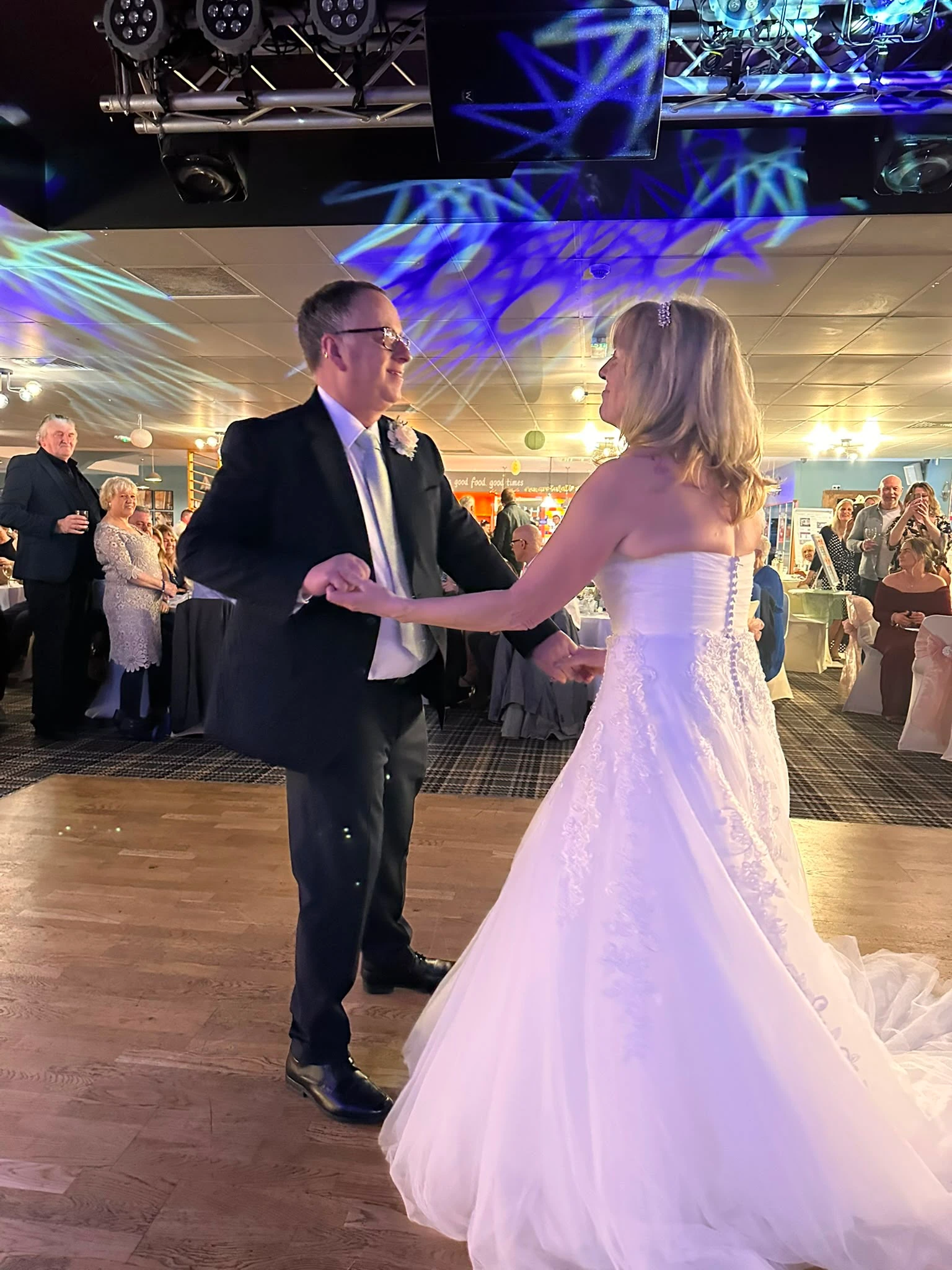 First dance beneath blue star projections