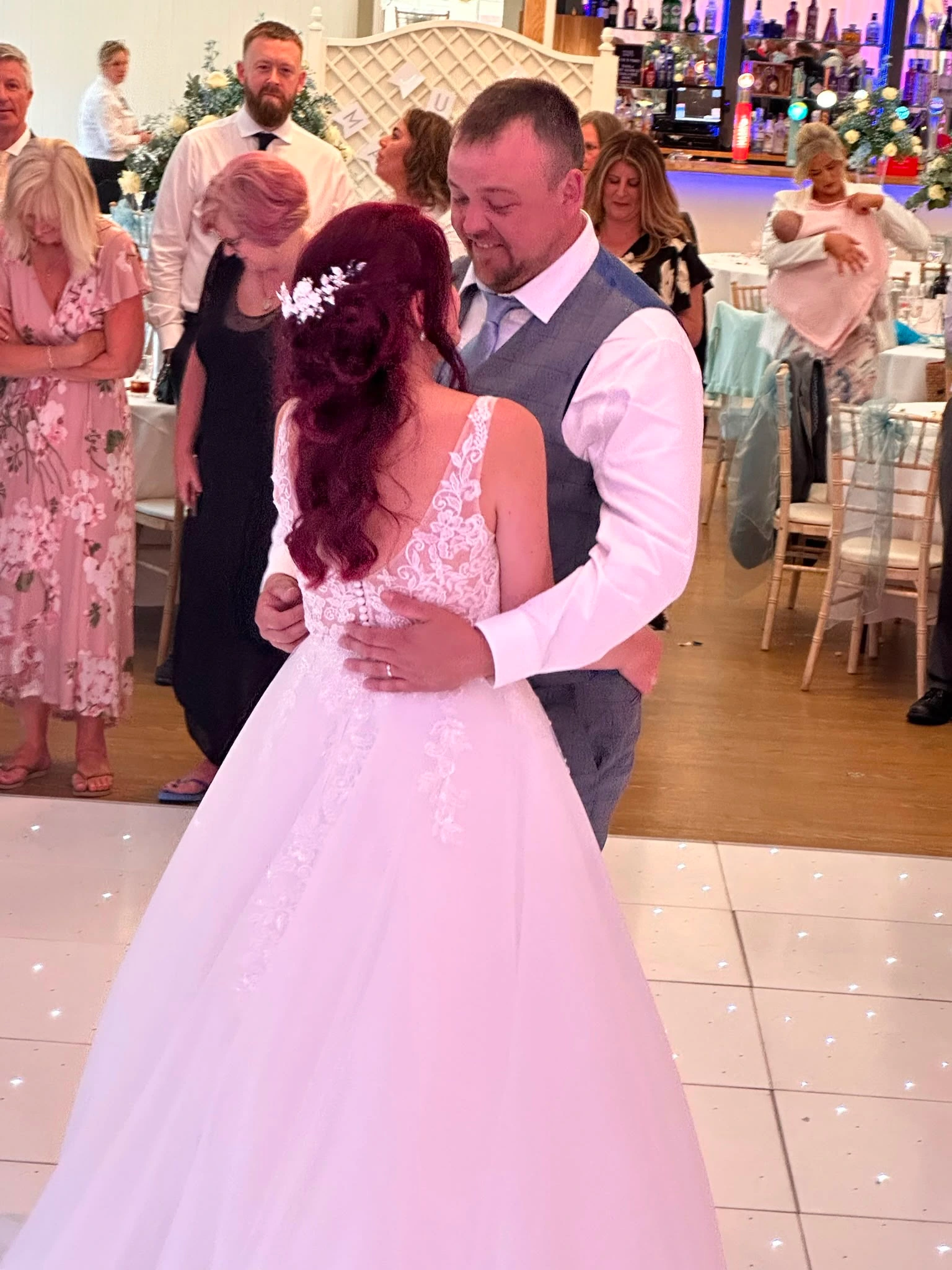 First dance on a white starlit dance floor