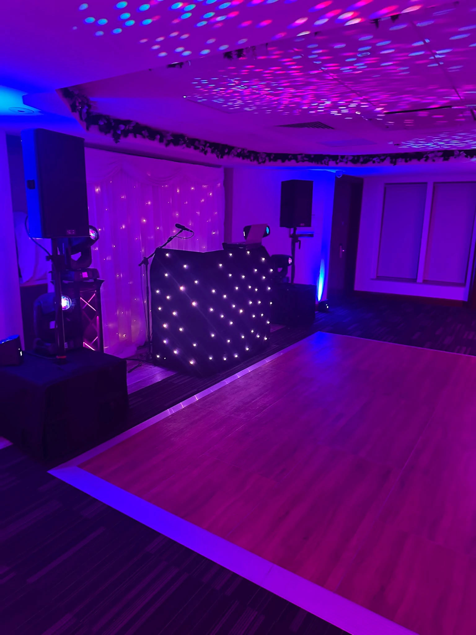 Star cloth booth against a fairy-light backdrop
