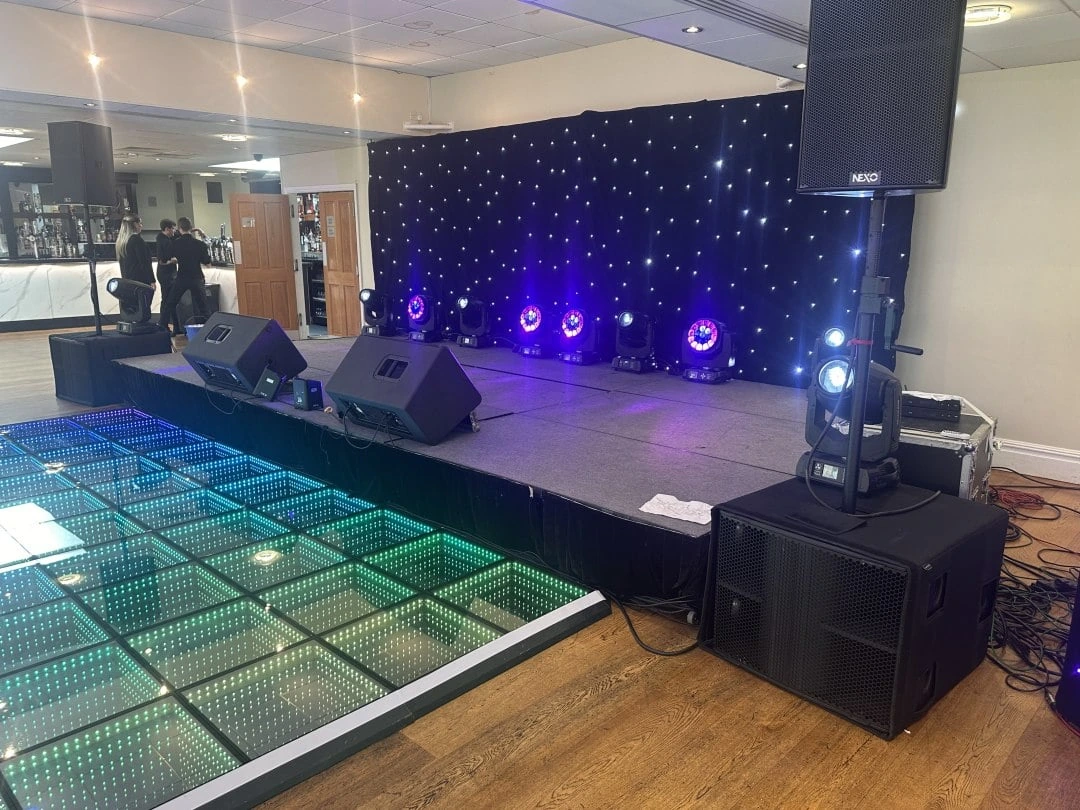 Checkerboard dance floor lit and waiting
