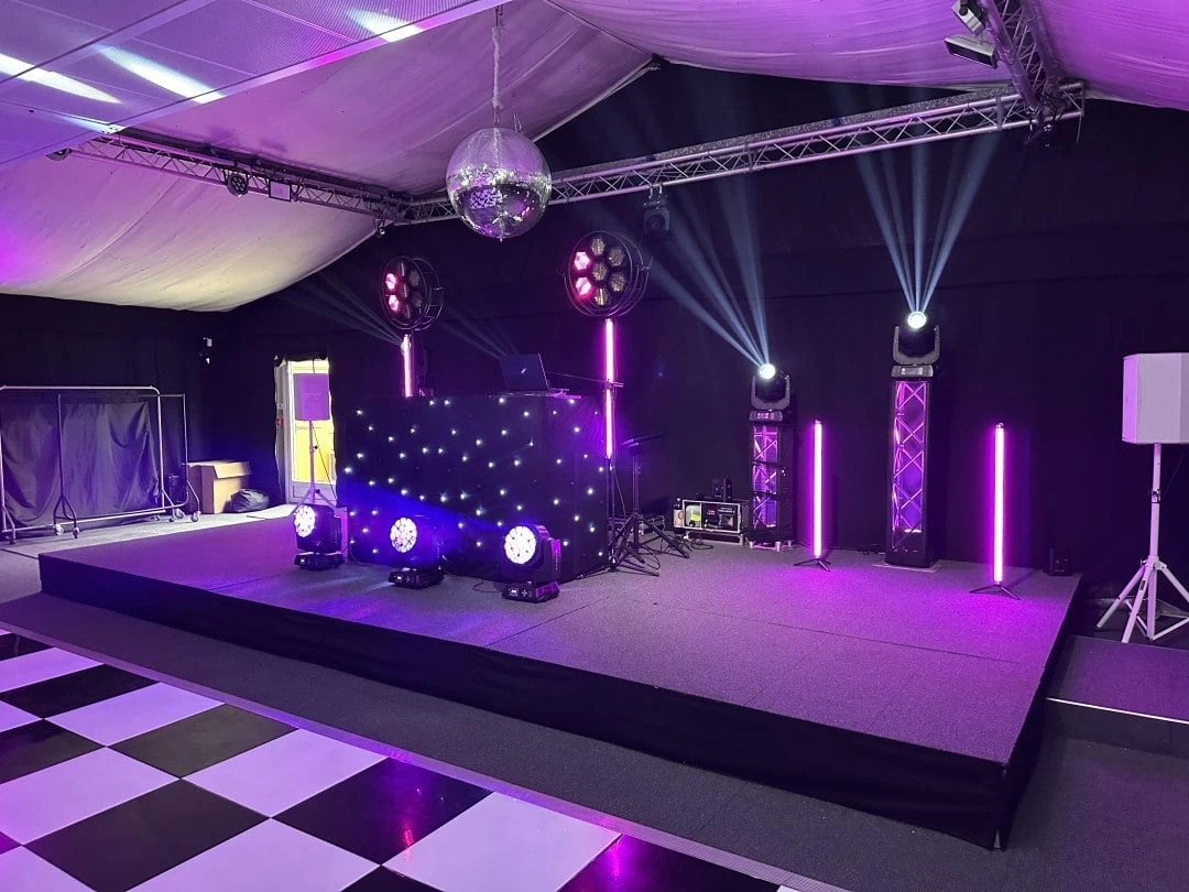 Star cloth backdrop and lighting rig in a marquee