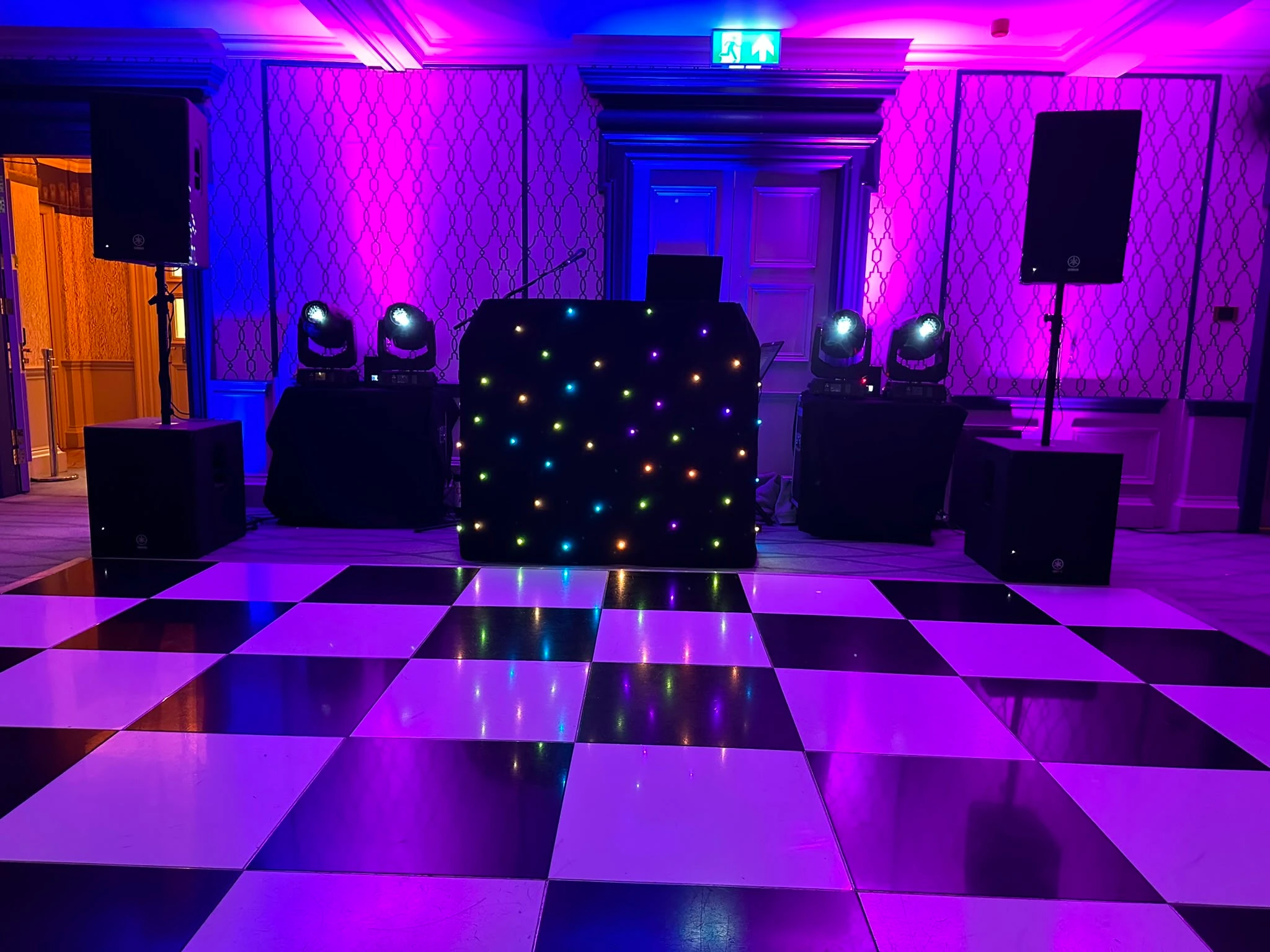 Black twinkle booth above a checkerboard floor