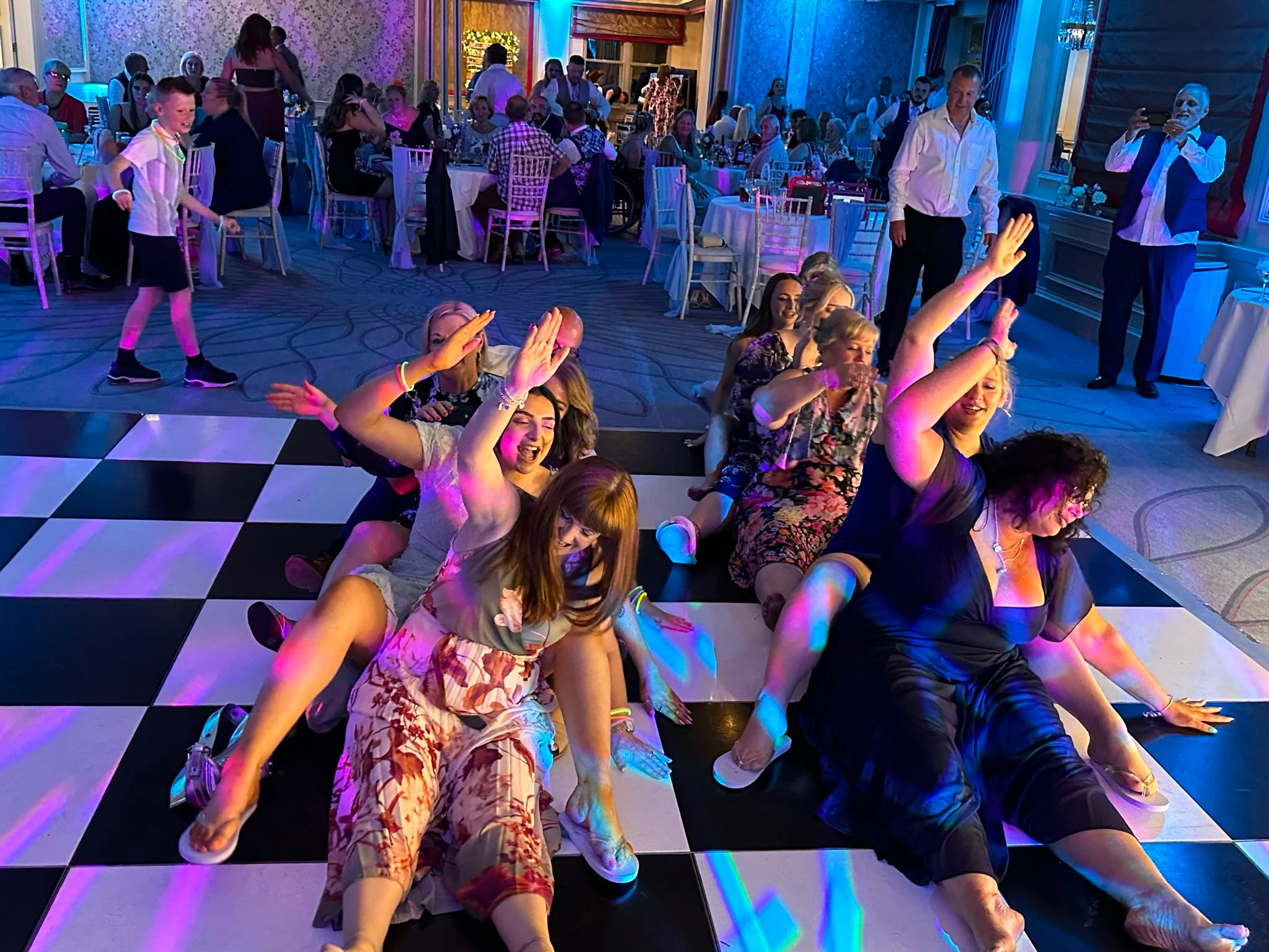 Guests sat on the floor mid-routine