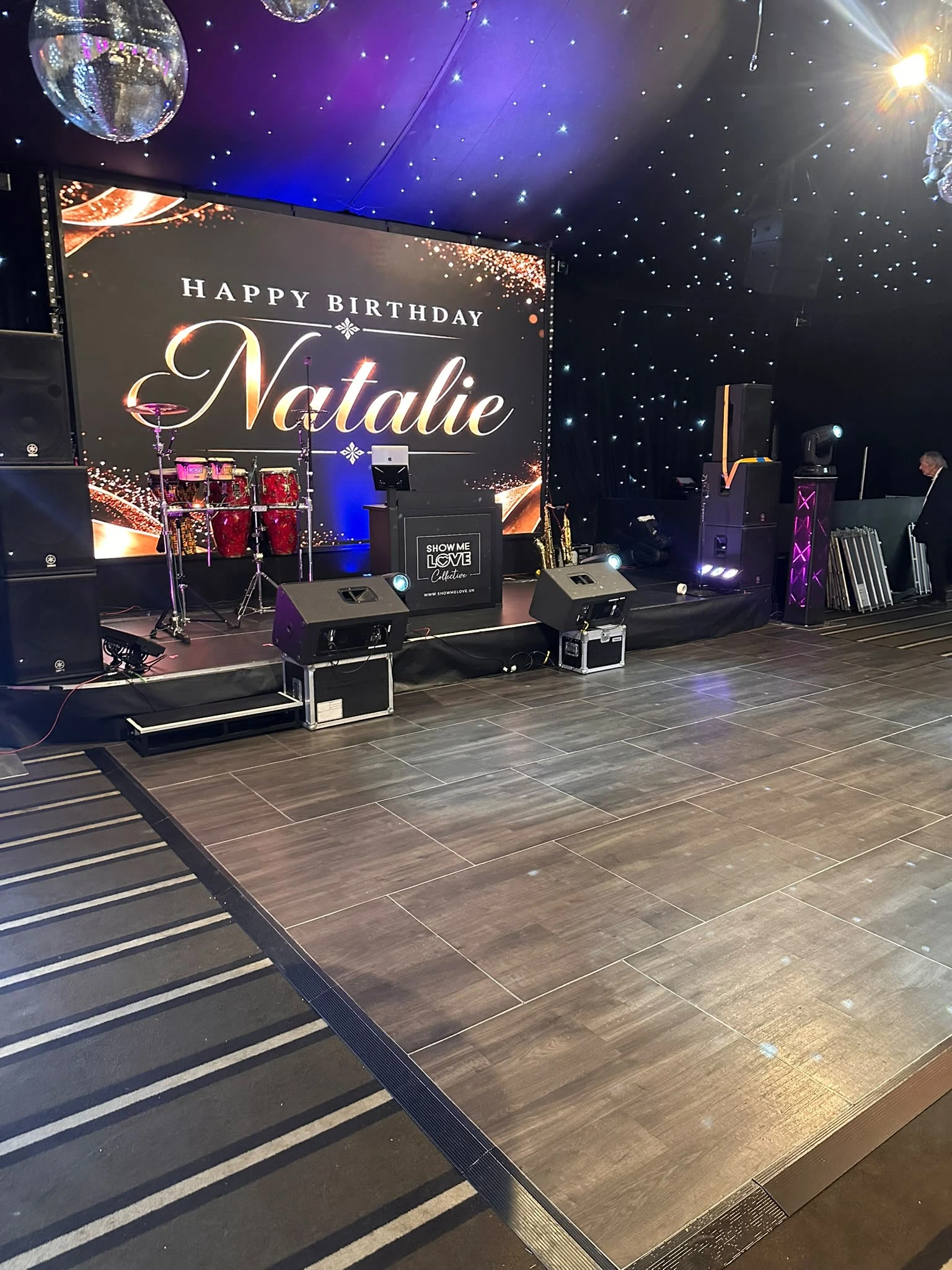 The Show Me Love stage — LED wall, staging and star cloth set for a milestone birthday