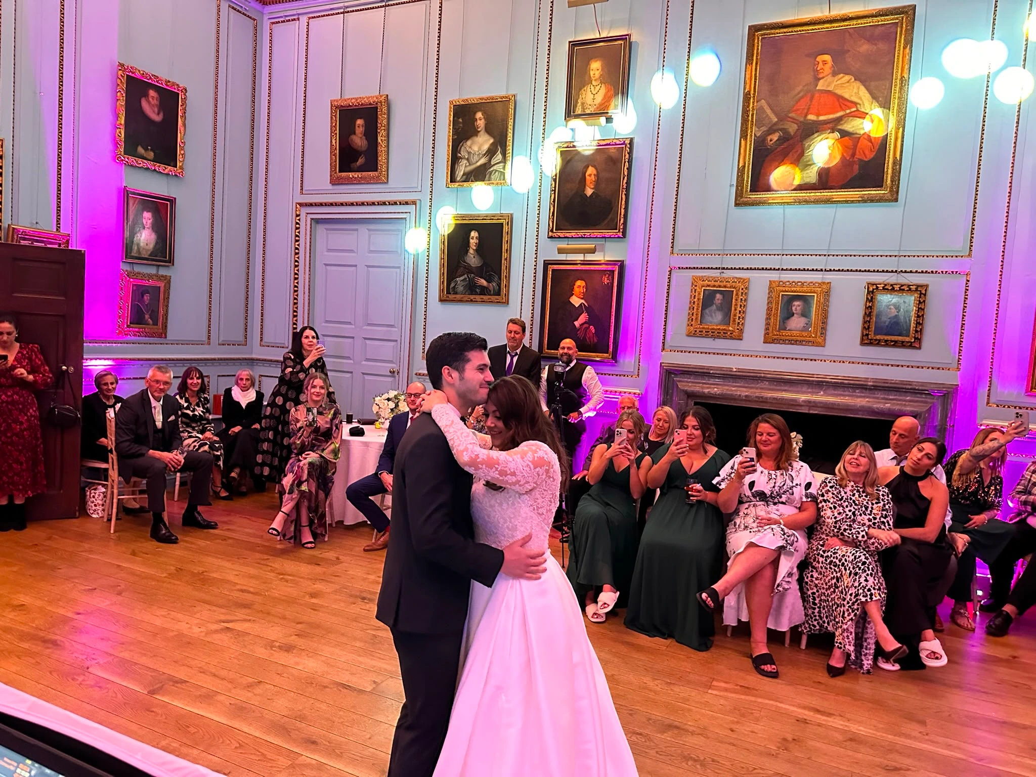 First dance in a portrait-hung state room